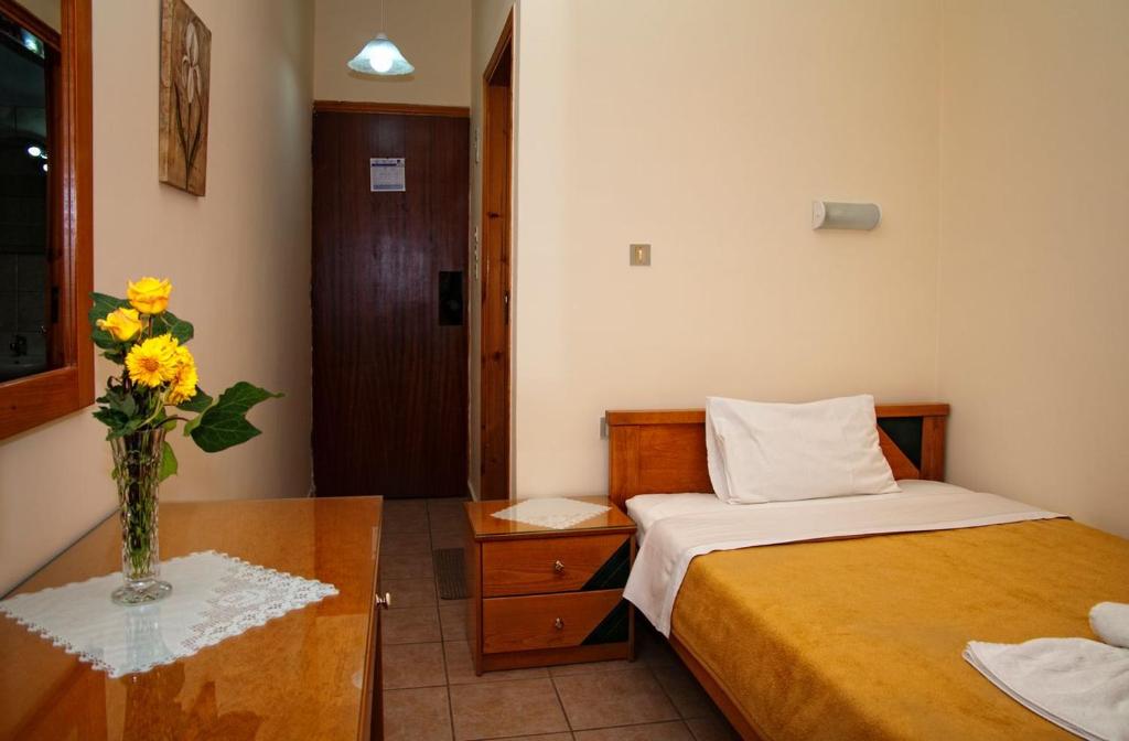 Postel nebo postele na pokoji v ubytování Nicolas Hotel