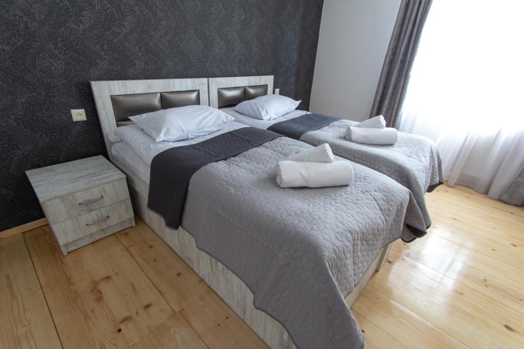Postel nebo postele na pokoji v ubytování Katos Guesthouse Mestia