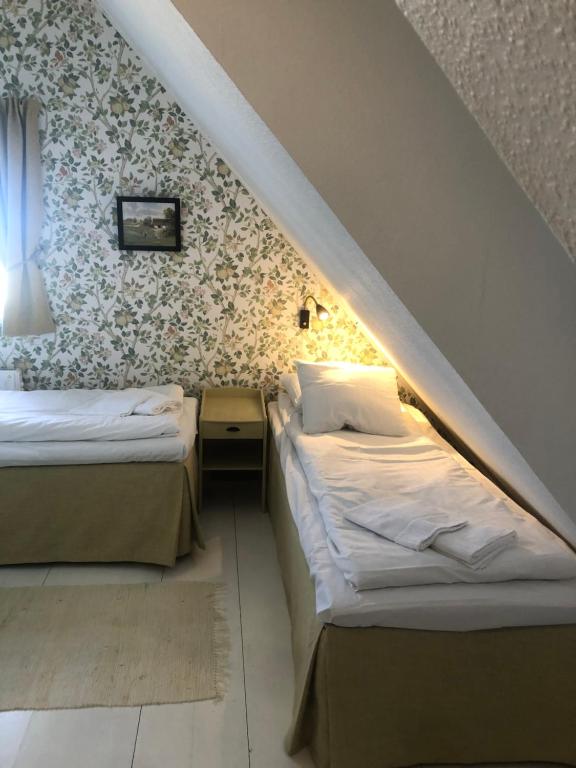 Letto o letti in una camera di Lunkaberg Bed & Breakfast