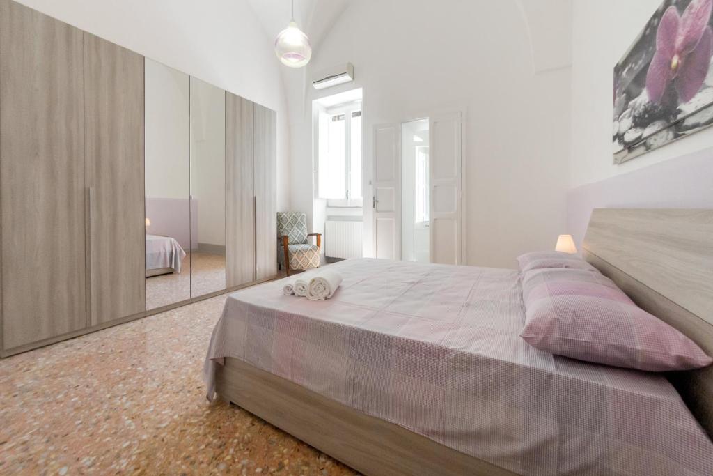 Łóżko lub łóżka w pokoju w obiekcie Casa Vacanze Penelope