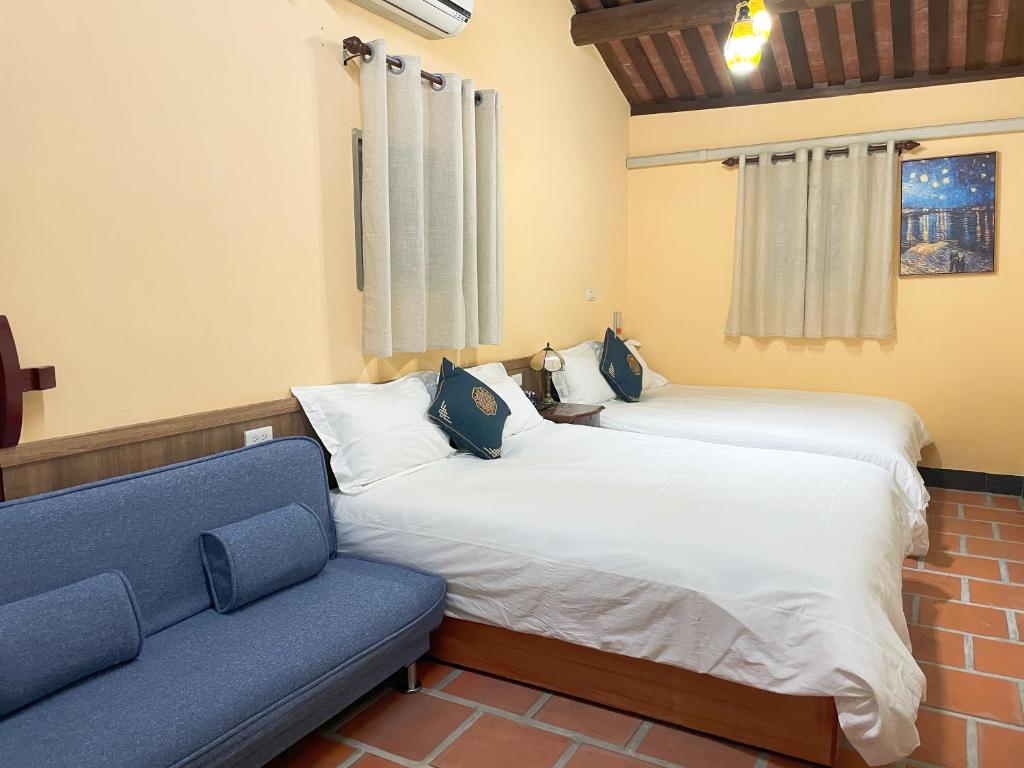 Postel nebo postele na pokoji v ubytování Xinqin B&B - City Area