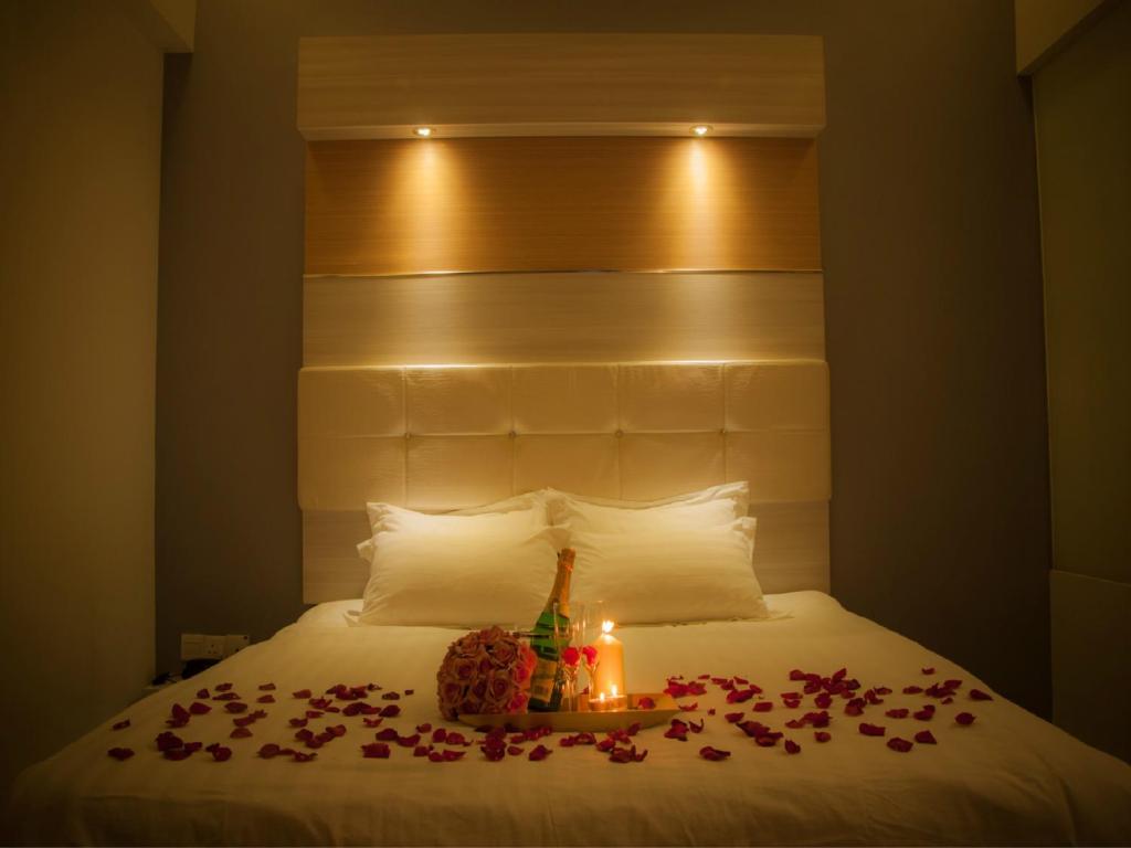 Postel nebo postele na pokoji v ubytování Avantgarde Hotel