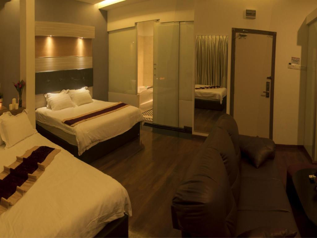 Postel nebo postele na pokoji v ubytování Avantgarde Hotel