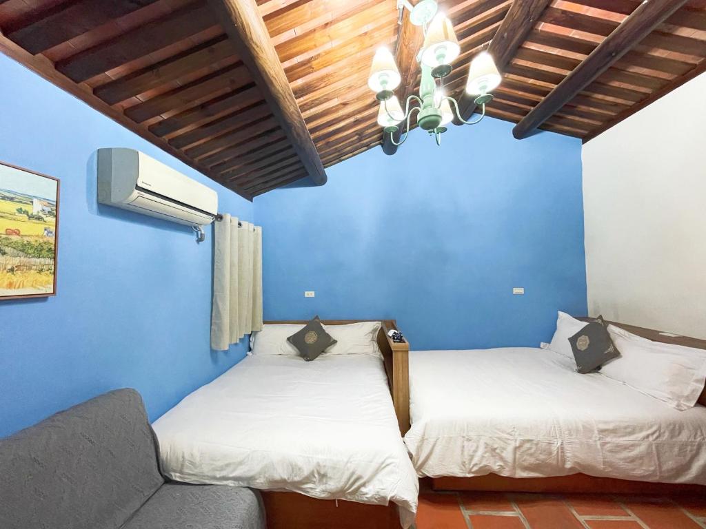 Postel nebo postele na pokoji v ubytování Xinqin B&B - City Area