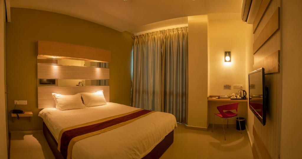 Postel nebo postele na pokoji v ubytování Avantgarde Hotel