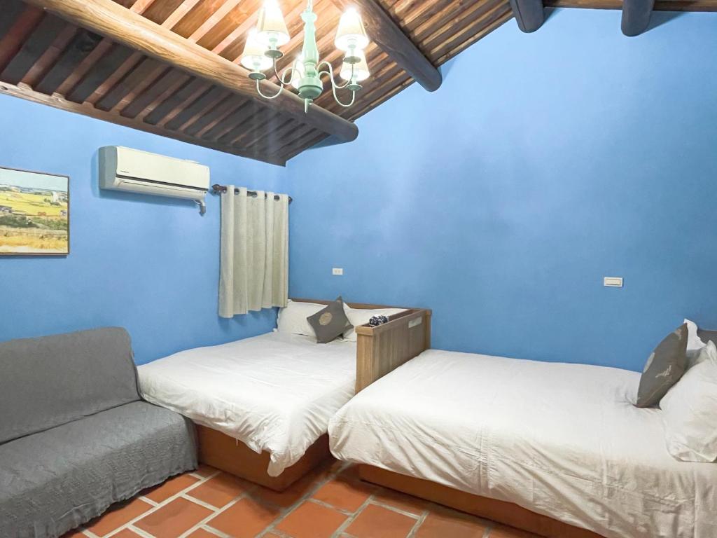 Postel nebo postele na pokoji v ubytování Xinqin B&B - City Area