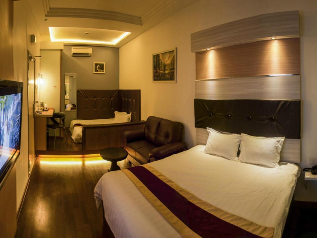 Postel nebo postele na pokoji v ubytování Avantgarde Hotel