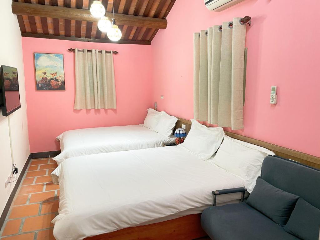 Postel nebo postele na pokoji v ubytování Xinqin B&B - City Area