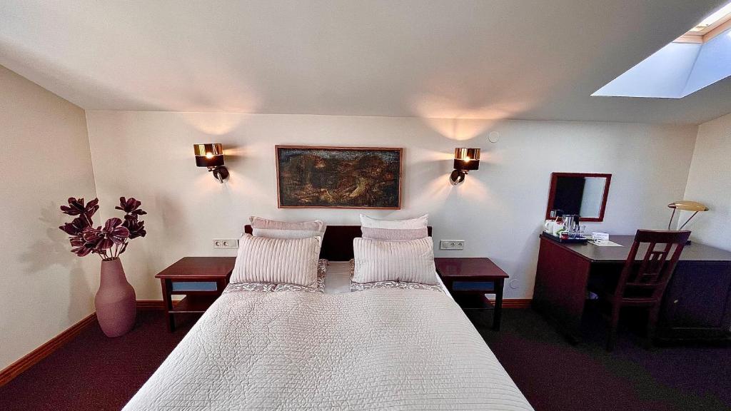 Postel nebo postele na pokoji v ubytování Hotel Vilhelmine