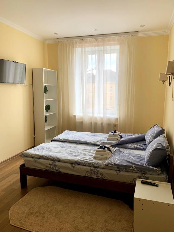 Postel nebo postele na pokoji v ubytování Homey apartment on Vicheva Str.