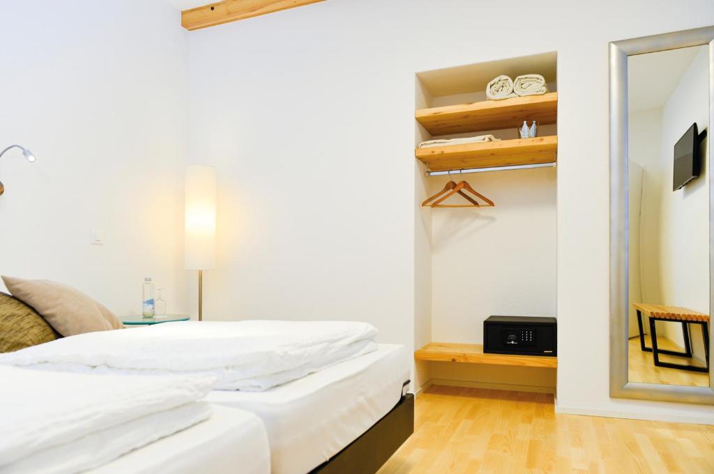 Postel nebo postele na pokoji v ubytování Hotel Baders Krone
