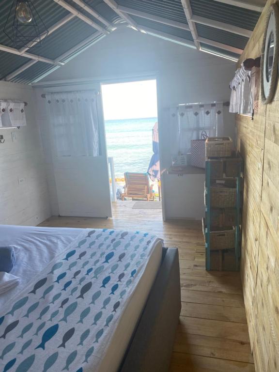Postel nebo postele na pokoji v ubytování Pura Vida Baru - La Casa del Cholo