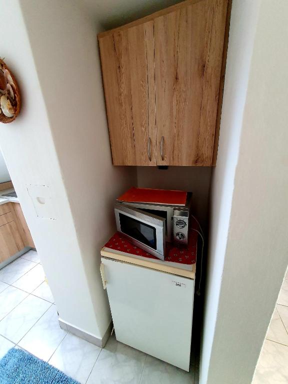 Kuchyň nebo kuchyňský kout v ubytování Szekrény Apartman