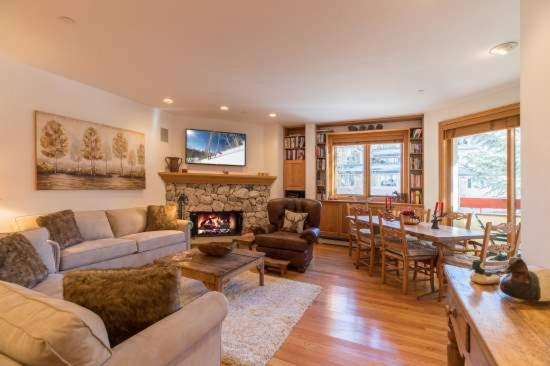 a living room with a couch and a fireplace at Strawberry Park Ski In Ski Out Condo in Beaver Creek