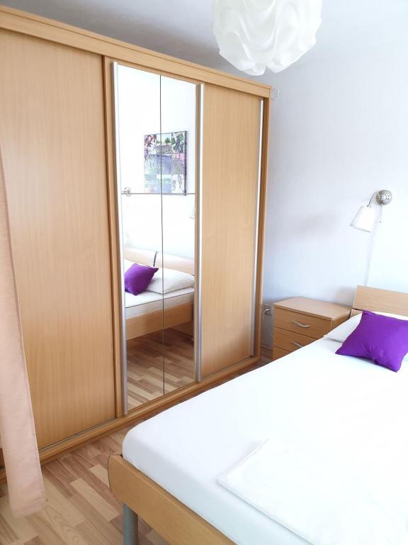 Postel nebo postele na pokoji v ubytování Apartments Andelic