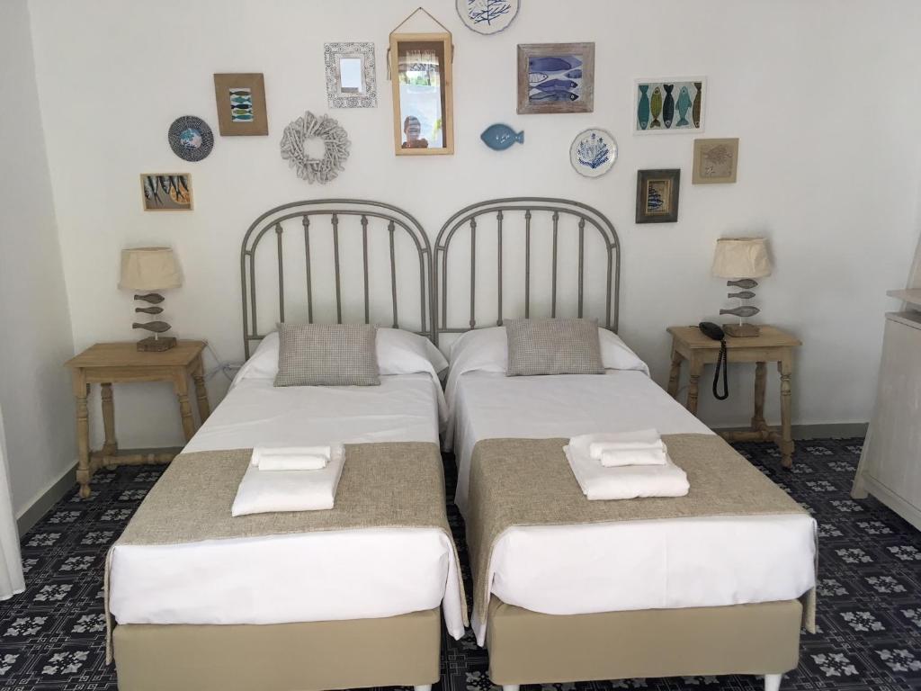 Postel nebo postele na pokoji v ubytování La Sciara Resort Hotel