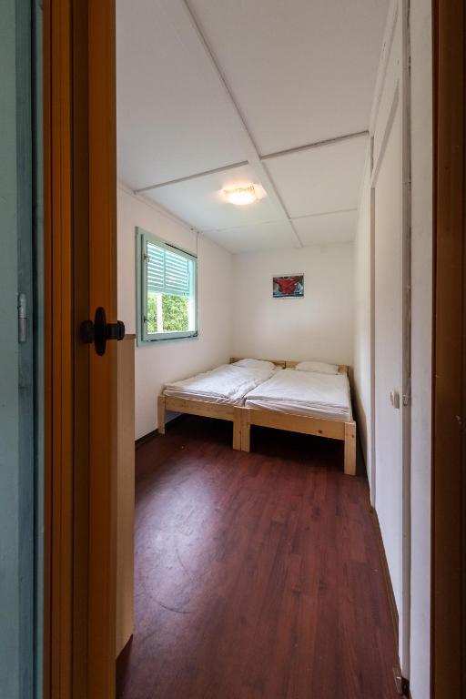 Postel nebo postele na pokoji v ubytování Penge Bungalók