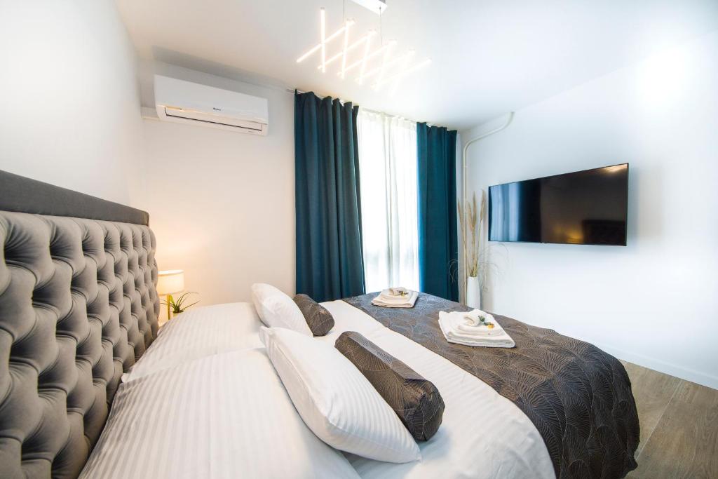 Posteľ alebo postele v izbe v ubytovaní RC Apartment