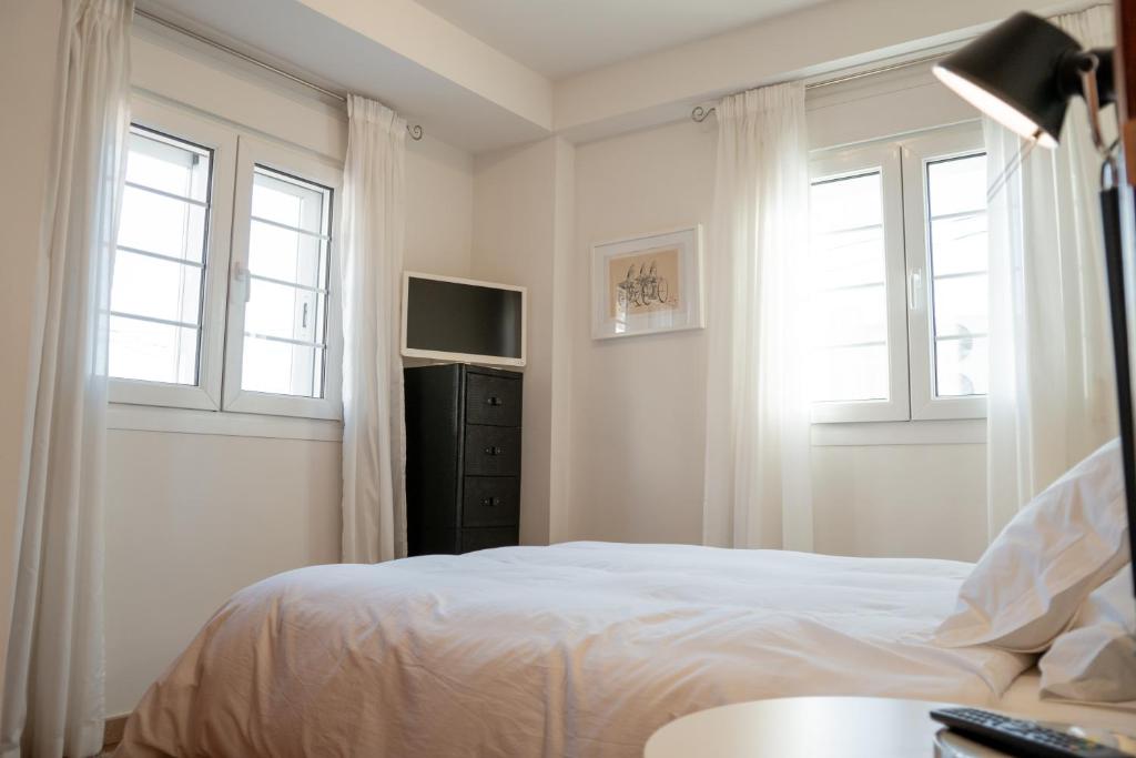Postel nebo postele na pokoji v ubytování Apartamentos La Llum