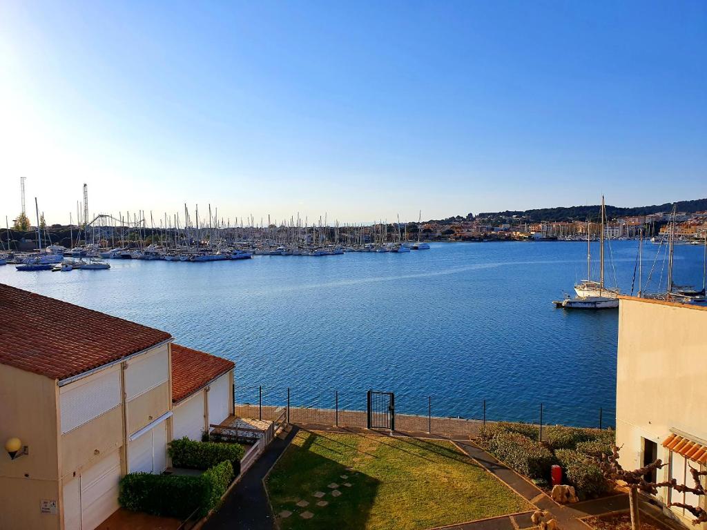 a view of a harbor with boats in the water at 46 Île Paradise Vue Port in Cap d'Agde