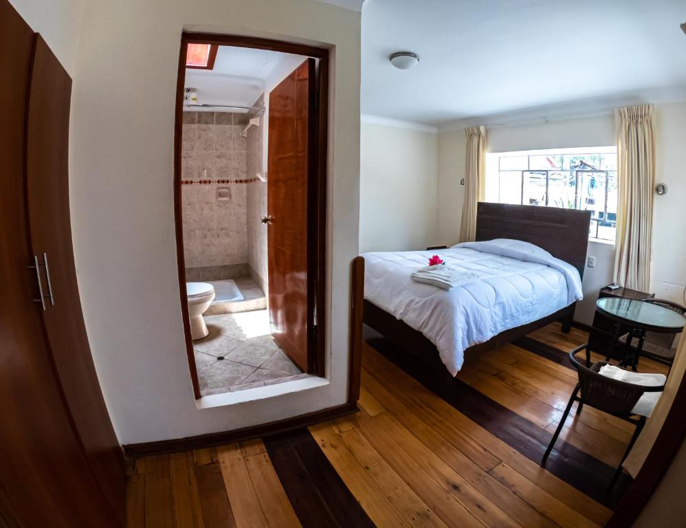 A bed or beds in a room at Hotel Los Laureles