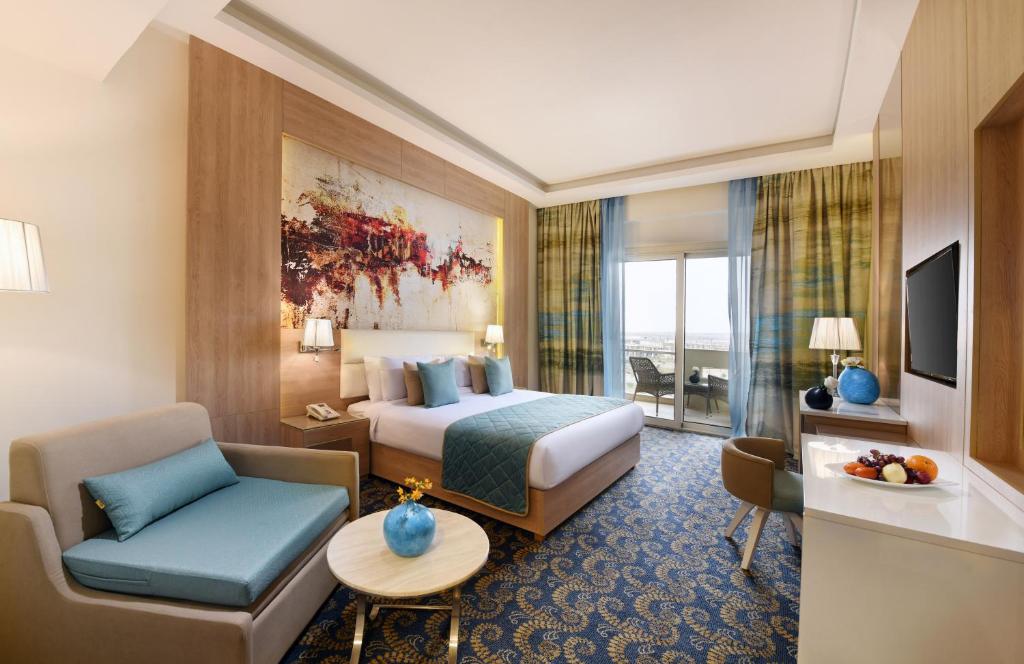 TV a/nebo společenská místnost v ubytování Tolip Gardens Hotel