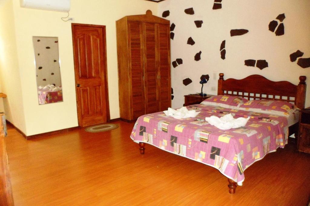 Postel nebo postele na pokoji v ubytování TipTop Hotel, Resto and Delishop