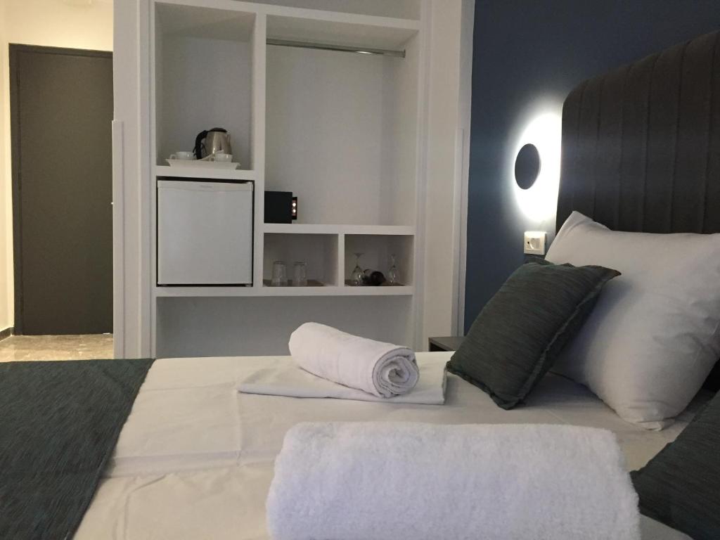 Ліжко або ліжка в номері City Pearl Hotel