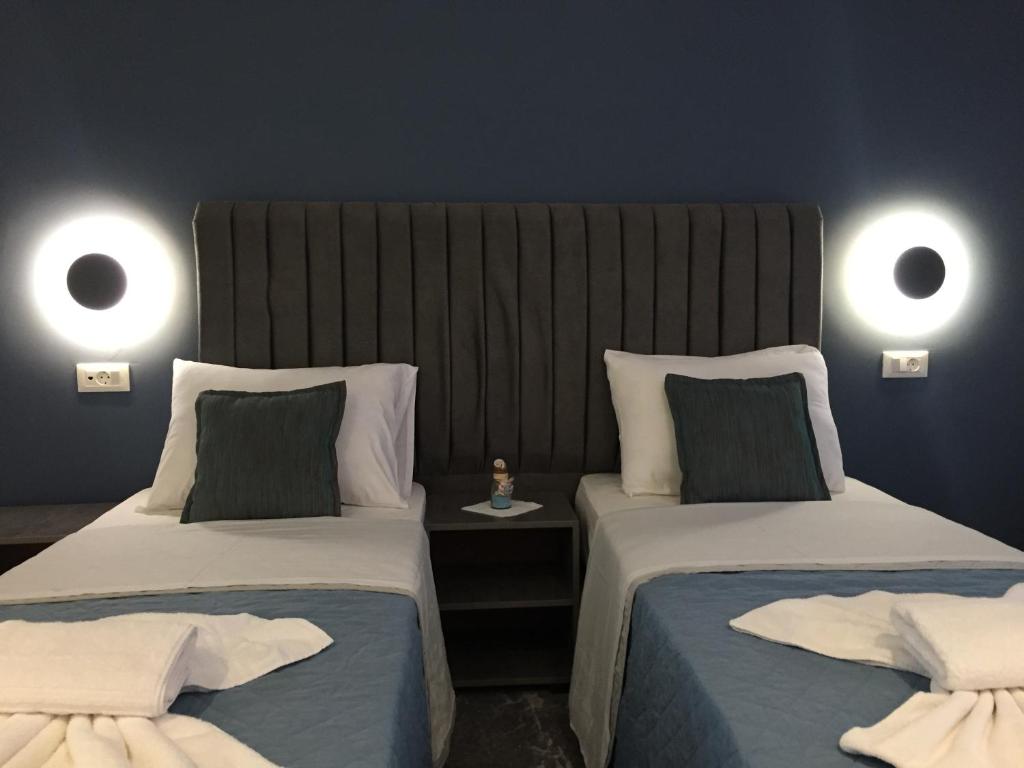 Ліжко або ліжка в номері City Pearl Hotel