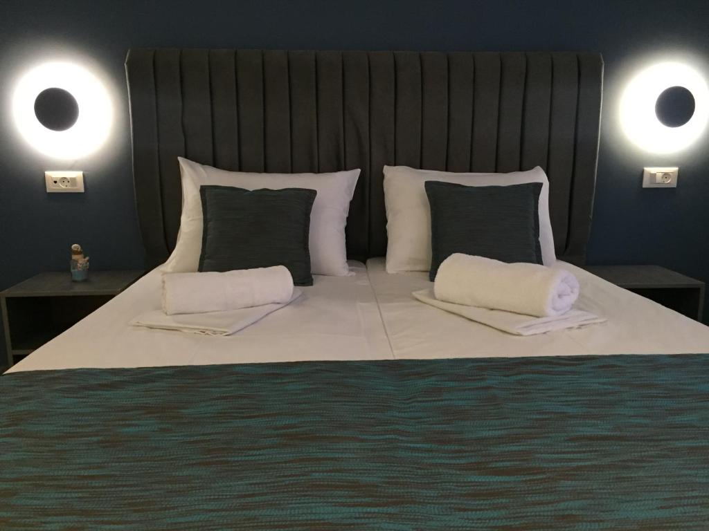 Ліжко або ліжка в номері City Pearl Hotel
