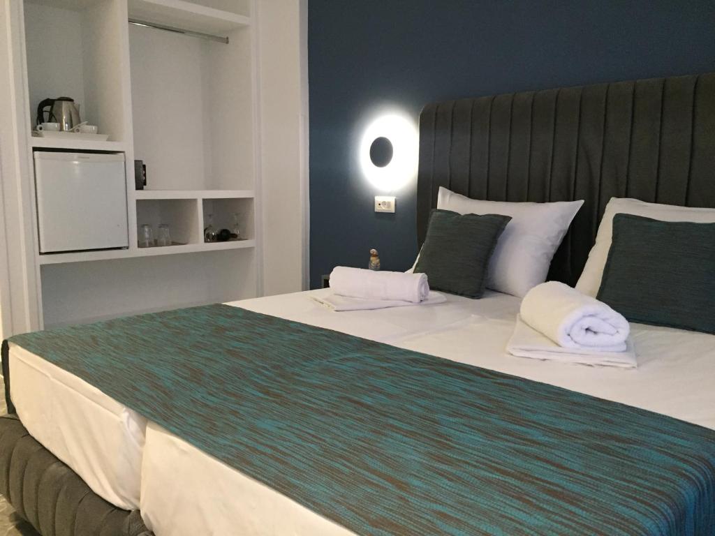 Ліжко або ліжка в номері City Pearl Hotel
