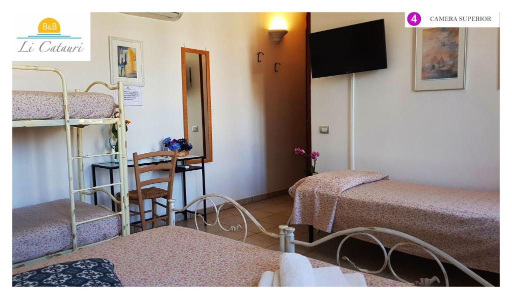 A bed or beds in a room at Li Catauri