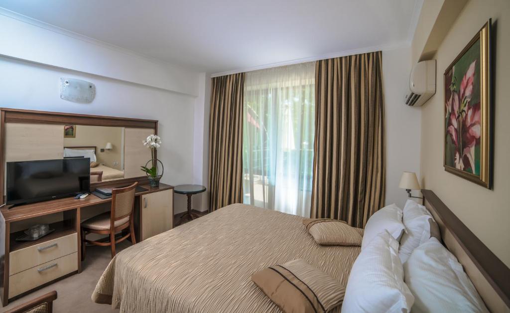 TV a/nebo společenská místnost v ubytování Hotel Saturn