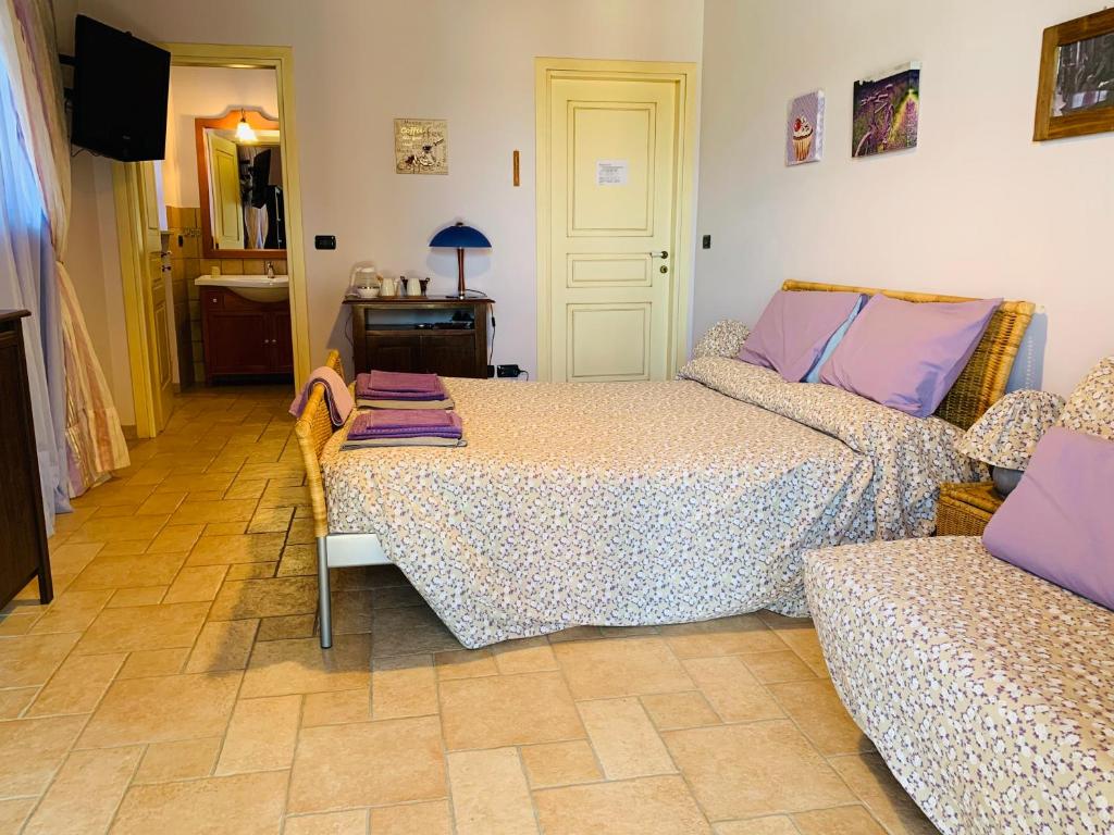 Postel nebo postele na pokoji v ubytování B&B Cascina Martinetta