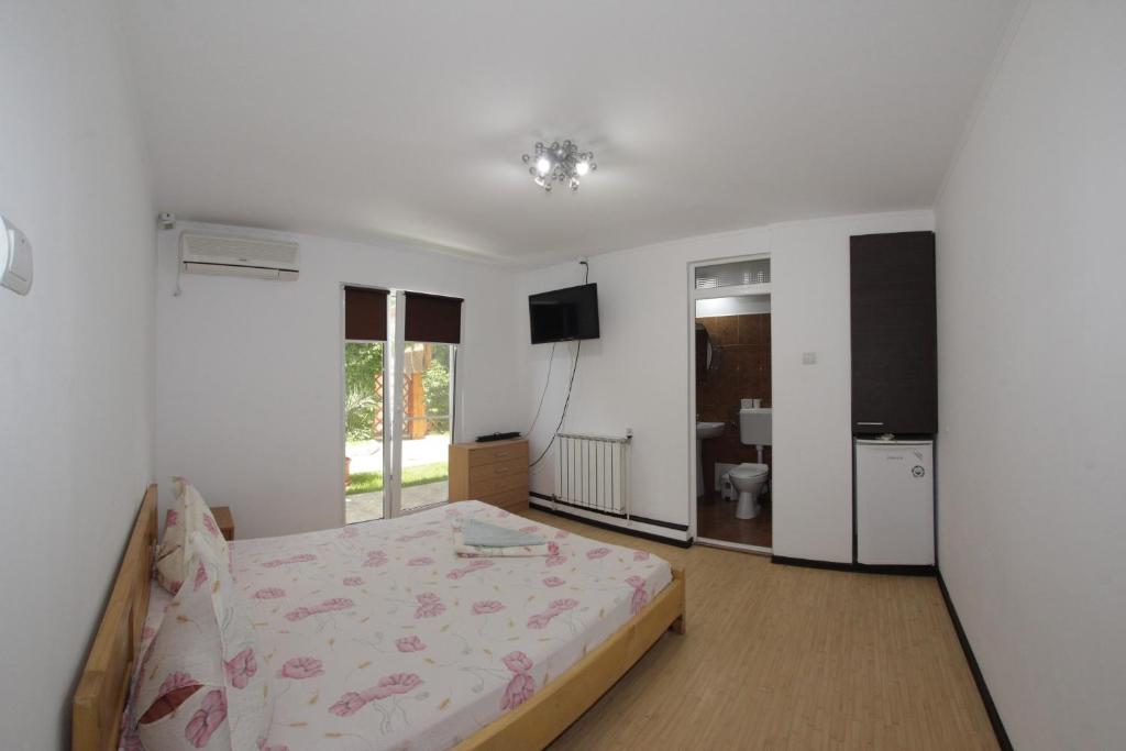 Postel nebo postele na pokoji v ubytování Casa Francisc
