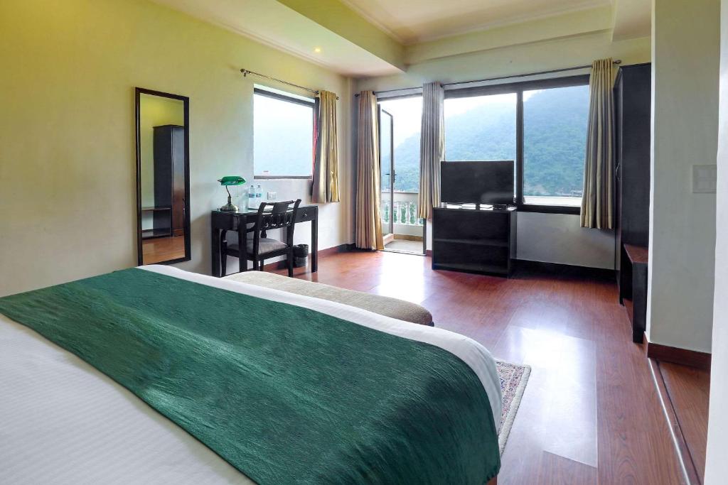 Postel nebo postele na pokoji v ubytování Hotel Dewa Retreat- A Himalayan Boutique Hotel