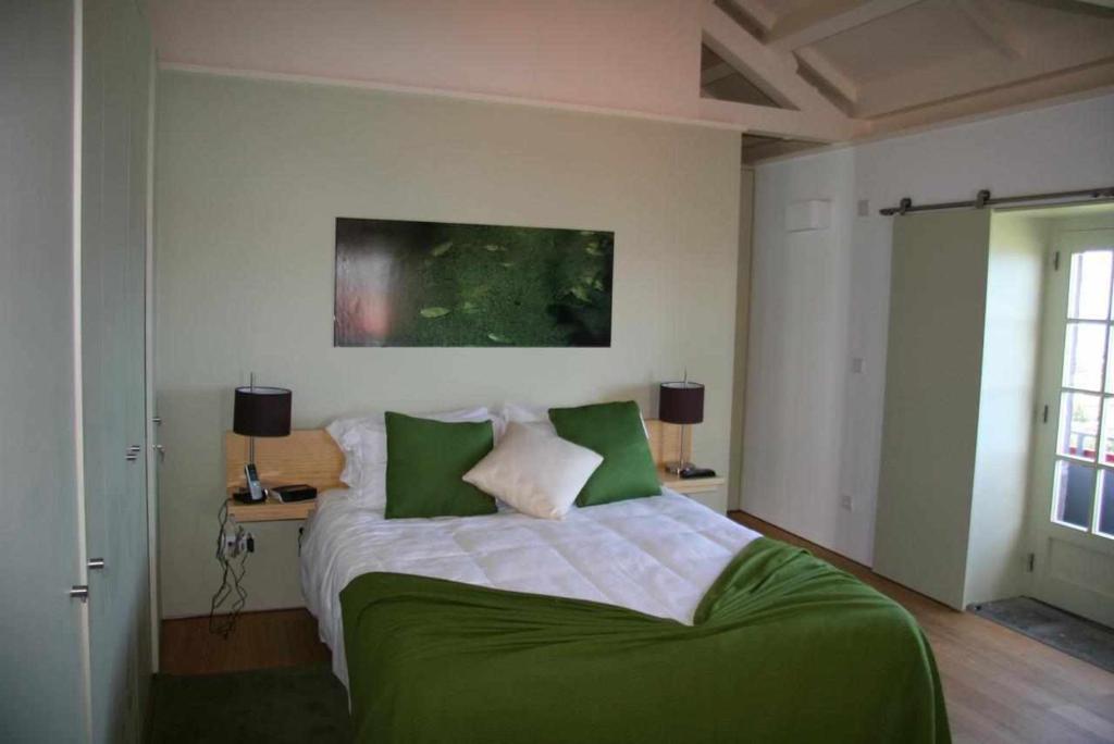 Postel nebo postele na pokoji v ubytování A Casa do Ouvidor