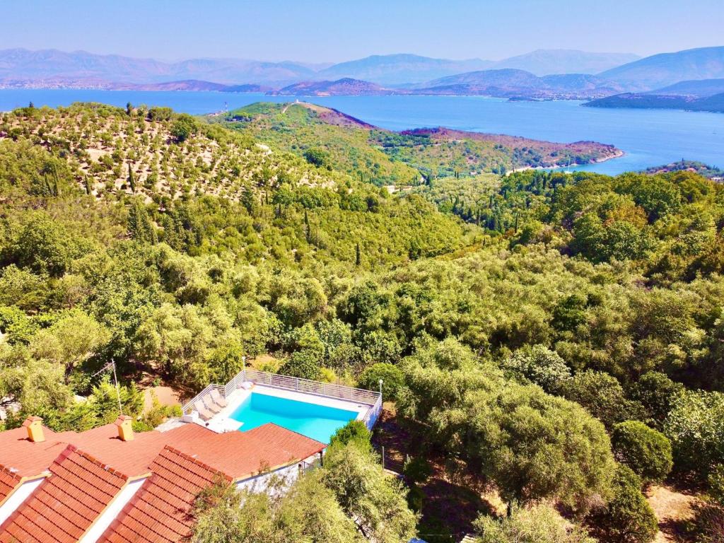 an aerial view of a villa with a swimming pool at Villa Marialetta St Stephanos with private pool by DadoVillas in Agnítsini