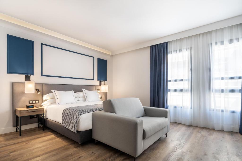 Postel nebo postele na pokoji v ubytování Hotel LIVVO Fataga