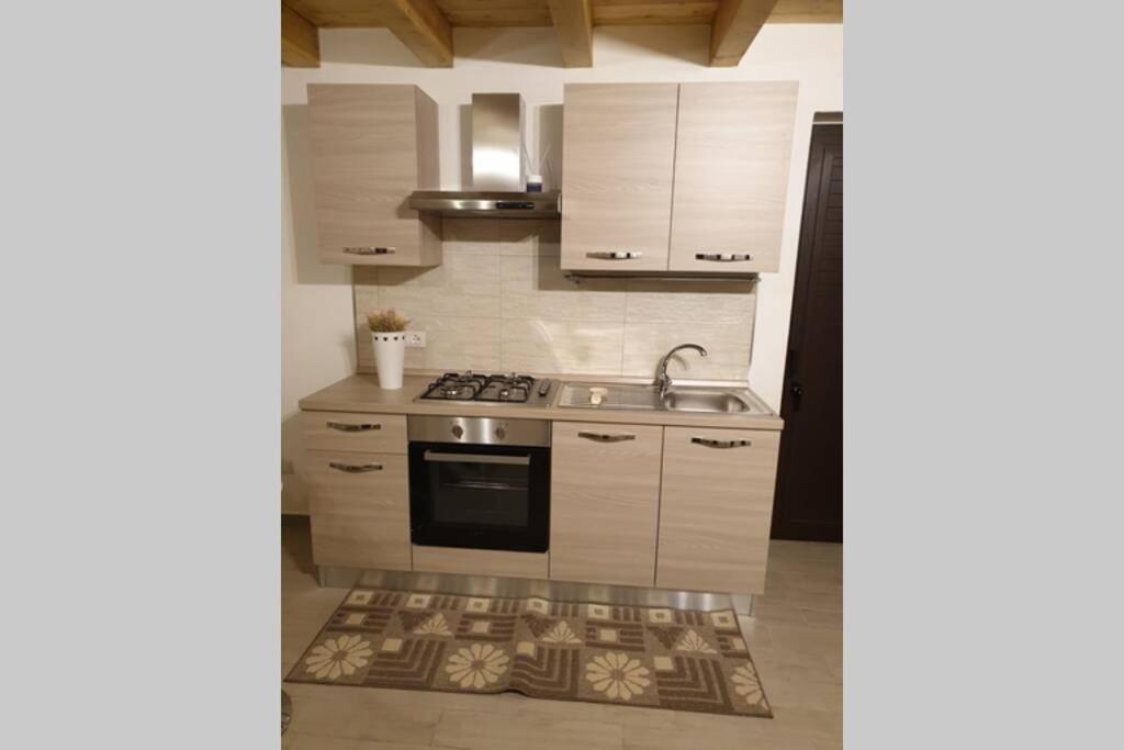 A kitchen or kitchenette at Appartamento VITTORIA