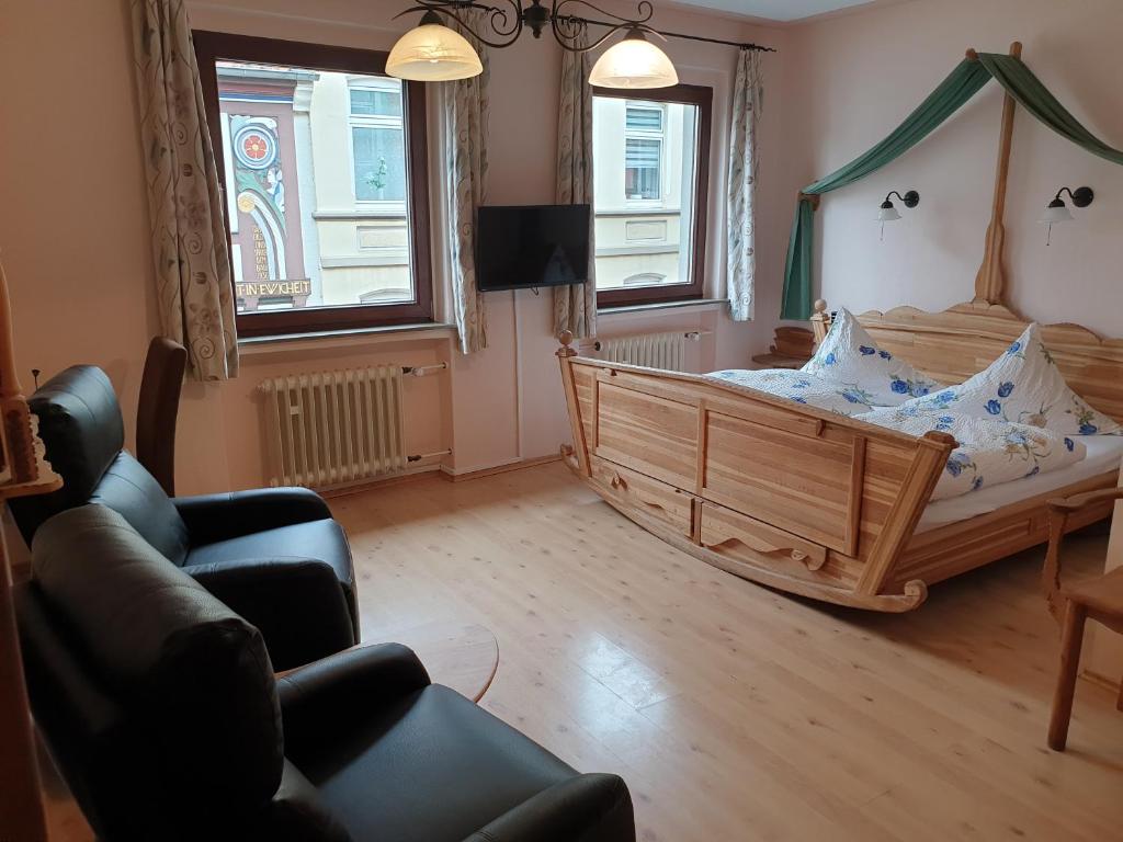 Postel nebo postele na pokoji v ubytování Hotel Altstadtwiege