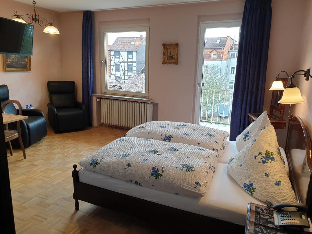 Postel nebo postele na pokoji v ubytování Hotel Altstadtwiege