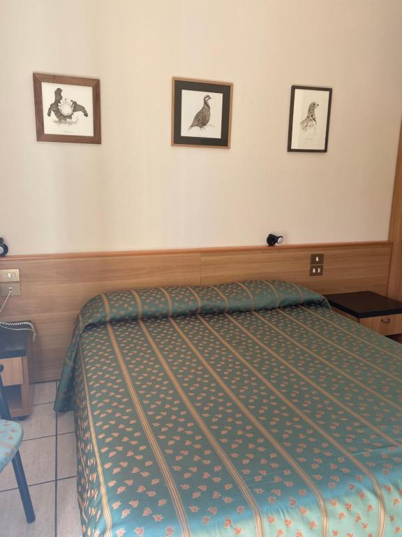 Postel nebo postele na pokoji v ubytování Hotel Del Fiume