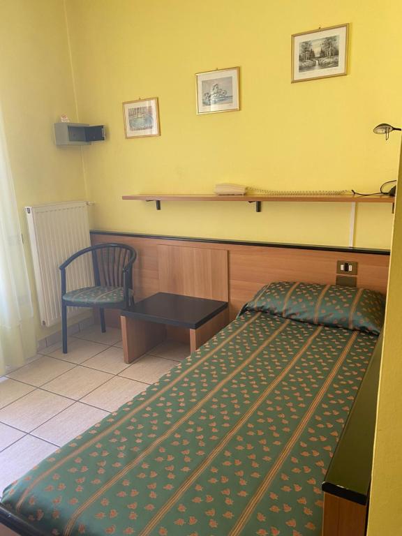 Postel nebo postele na pokoji v ubytování Hotel Del Fiume