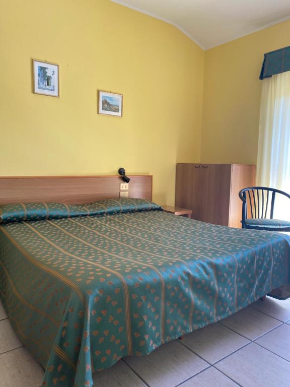 Postel nebo postele na pokoji v ubytování Hotel Del Fiume