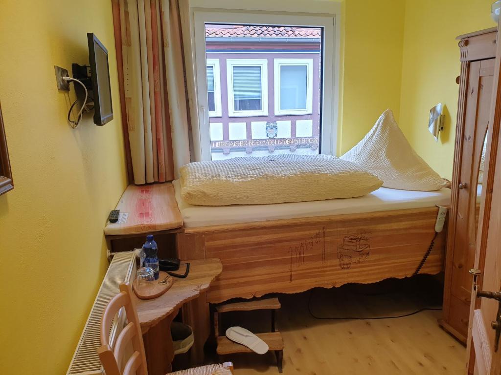 Postel nebo postele na pokoji v ubytování Hotel Altstadtwiege