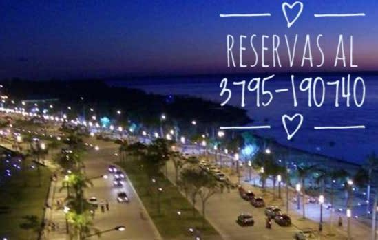 a night view of a street with cars and lights at Posada MARTINEZ in Corrientes