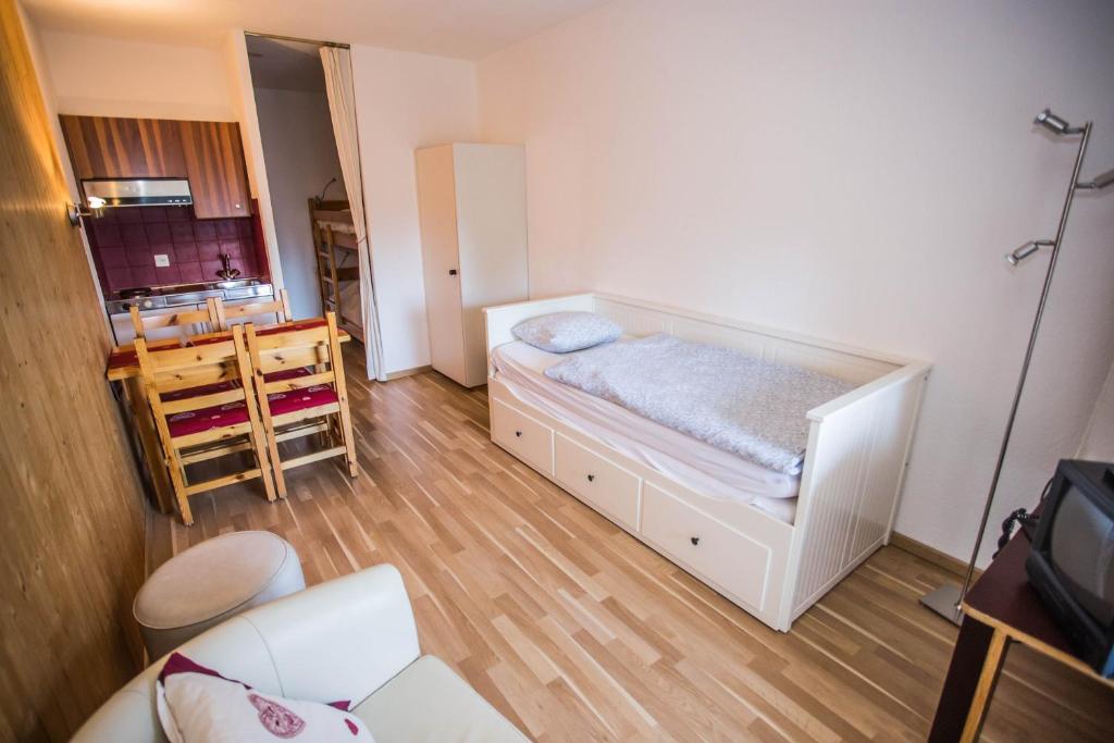 Postel nebo postele na pokoji v ubytování Eden Resort Anzère