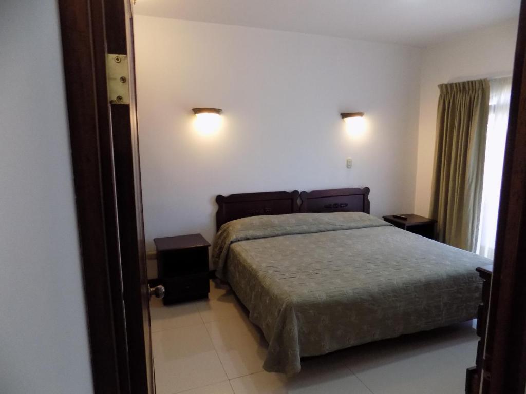 Postel nebo postele na pokoji v ubytování Hotel Plaza Real Suites & Apartments San Jose