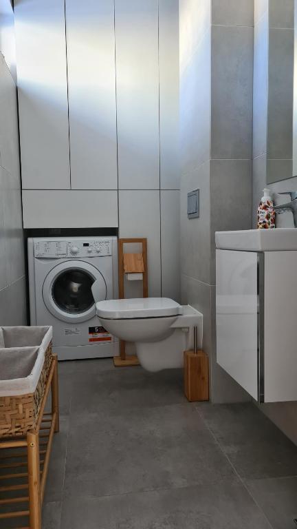 Posteľ alebo postele v izbe v ubytovaní AZURE Apartament Pobierowo